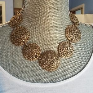 Goldtone circular  statement necklace